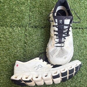 On Running Cream and Black Athletic Shoes